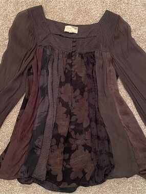 100% Silk square neck blouse. Sheer sleeves with single button cuff.
